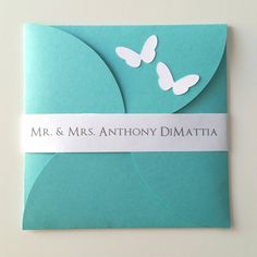 a wedding card with butterflies on it and the words mr & mrs anthony dimatta