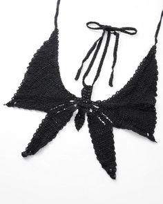 Details: Crochet bralet with butterfly-shape designTop Length: CroppedSleeve Length: SleevelessMaterials:100% Acrylic Black Crochet Top For Summer Party, Summer Triangle Crop Top For Party, Black Triangle Crop Top For Festival, Black Triangle Top Crop Top For Festival, Black Bohemian Halter Top For Party, Black Crochet Top For Summer Festival, Black Triangle Crop Top For Beach, Seamless Summer Halter Top For Party, Black Cropped Halter Top For Beach