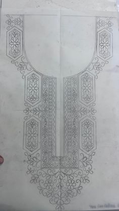 a drawing of an ornate design on paper