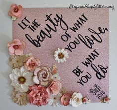 a pink sign with flowers on it that says, let the beauty what you have be what you do