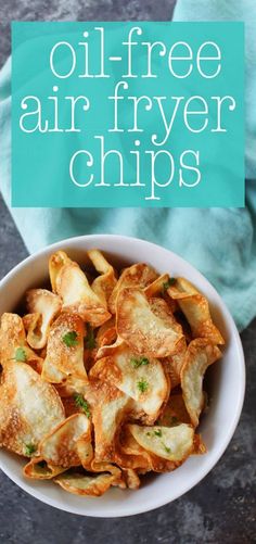 a bowl filled with fried air fryer chips on top of a blue towel next to a