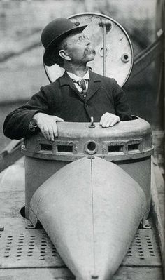 a black and white photo of a man in a hot tub with the caption submarine day