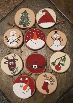 twelve decorated christmas cookies arranged in the shape of santa hats, reindeers and snowmen