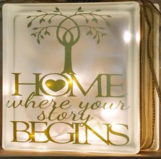 a lighted sign that says home where your story begins