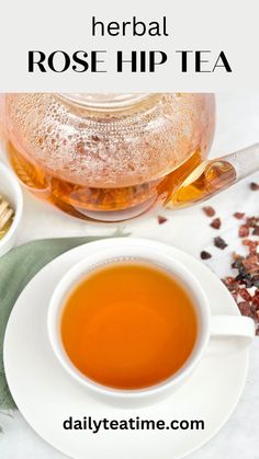 a cup of tea with the words herb rose hip tea next to it on a white plate