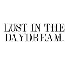 the words lost in the daydream are black and white on a white background