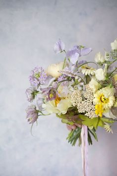 a bouquet of flowers sitting on top of a table