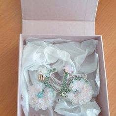 an open box with some white flowers in it