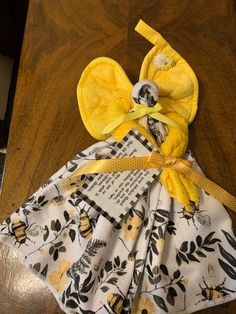 a piece of cloth has been made to look like a dress with yellow flowers on it