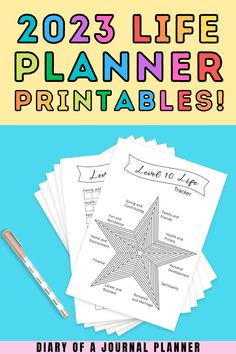 the 2021 planner printables are on top of each other and there is a pen next to it