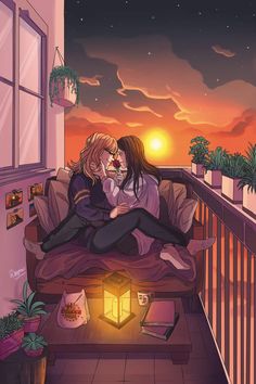 two people sitting on a bed in front of a window at night with the sun setting