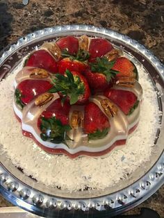 there is a cake with strawberries on it