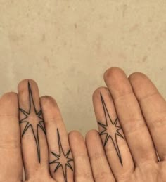 two fingers with small stars on them