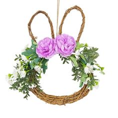 a wreath with flowers hanging from it