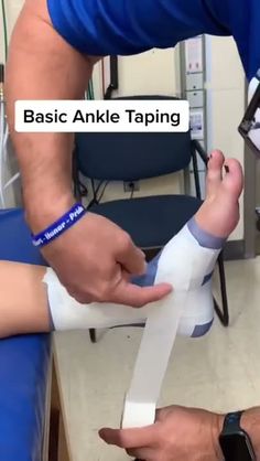 a man is wrapping an ankle with tape