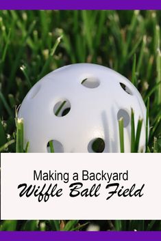 a white helmet sitting in the grass with words making a backyard wiffle ball field