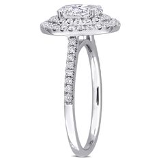 a white gold ring with two rows of diamonds on the band and an oval center stone surrounded