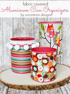 three fabric covered canisters sitting on top of a tree stump with text overlay that says, fabric covered aluminum can containers by uncommon design