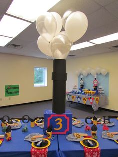 a birthday party with balloons and decorations