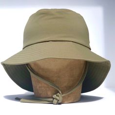 Designed with the boys in mind (but most definitely gender neutral), the stylish yet super practical fini. sailor hat in Khaki is made from soft textured cotton, has an extra wide brim with long back for increased sun protection. Button the brim sides up for the super cool sailor look Keep the brim sides down & flip up the front for a trendy casual look Keep this gorgeous hat it in its natural style with the full brim down for ultimate sun protection Multiple ways to style to suit every bebe! *d Hat Business, Baby Turban, Sailor Hat, Hand Dyed Fabric, Coconut Shell, Green Gables, Natural Style, Hat Making, Wide Brimmed