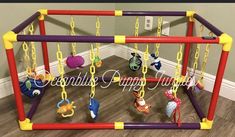 a play gym with toys hanging from it's sides