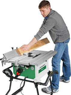 a man using a table saw to cut wood