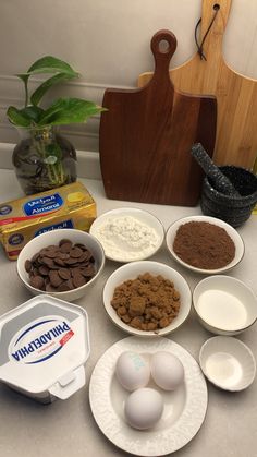 there are many different ingredients in bowls on the counter