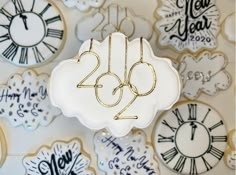 decorated cookies with numbers and clocks on them