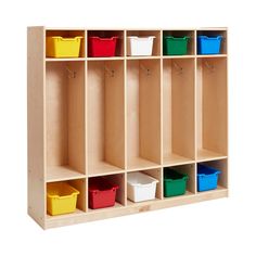 a wooden cubby with six bins and several different colored baskets on the sides