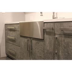 an image of a kitchen setting with granite counter tops and cabinets in the bathroom area