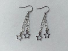 Silver star chain earrings North star jewelry Polar star earrings Gothic earrings Celestial earring Rock star’s girlfriend earring Grunge Punk Style Star-shaped Metal Earrings, Star-shaped Metal Earrings With Dangling Charms, Star-shaped Metal Jewelry With Dangling Charms, Celestial Earring, Polar Star, Earrings Gothic, Gothic Earrings, Star Chain, Star Jewelry