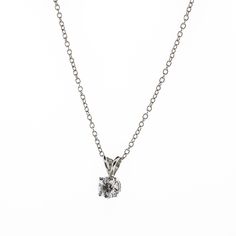 There's something classic and luxurious about a high quality single diamond hanging around your neck. This diamond solitaire pendant necklace is made from solid platinum and measures 18" long. The diamond is GIA certified as an all-natural .92ct G/VS2 round brilliant cut diamond securely set in a four prong basket style setting. This necklace comes with the GIA certificate and a free official appraisal showing the value of the necklace at $9650. Timeless Silver Solitaire Necklace With Single Diamond, Silver Platinum Solitaire Necklace With Brilliant Cut, Silver Solitaire Necklace With Brilliant Cut For Formal Occasions, Formal Silver Solitaire Necklace With Brilliant Cut, Formal Silver Diamond Cut Solitaire Necklace, Timeless Sterling Silver Solitaire Necklace, Classic Single Diamond Pendant Necklace, Classic Platinum Solitaire Necklace With Single Diamond, Classic Diamond Round Pendant Necklace