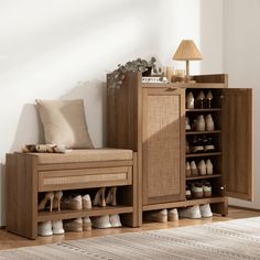 a wooden shoe rack sitting next to a lamp on top of a hard wood floor