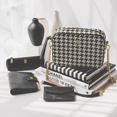 Soigné Houndstooth Classic Handbag Historically labeled as the pattern of wealth, and modernly tagged as the pattern of elegance, the luxurious black houndstooth pattern is one you can't resist. Say Hello! to the Soigné Crossbody Camera handbag, the new IT, and breakout bag from NOTIQ's Founder, Designer, and Chief Elegant Officer, V.J. Elevate your personal presentation and appearance, communicate your elegance and keep your personal belongings organized. This luxe handbag is poised to complete Luxe Handbags, Black Houndstooth, Classic Handbags, Houndstooth Pattern, Handmade Handbags, Gold Zipper, Black Pattern, Black Handbags, Chain Strap