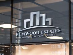 the entrance to elmwood estates commercial real estate, which is located in an office building