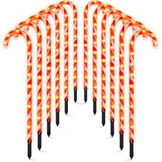 christmas candy canes with lights on them are arranged in the shape of an arrow