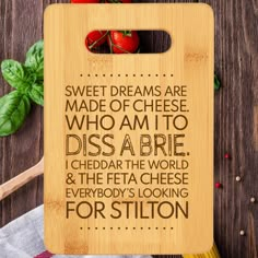 a cutting board that has some food on it with the words, sweet dreams are made of cheese who am to disa arie