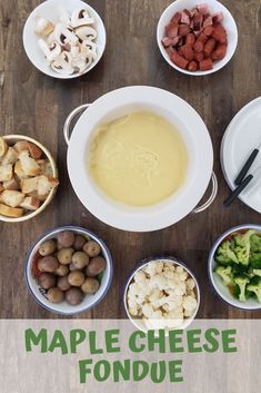 a table topped with bowls filled with different types of food next to plates and utensils