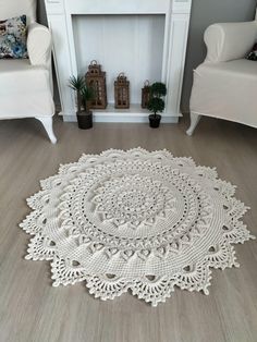 a white rug on the floor in front of a fireplace