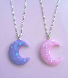 two necklaces with stars and crescent shapes on them