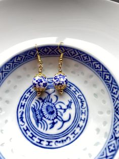 Porcelain Earrings Blue White Floral Gold Earrings Gold | Etsy Gift Pearl Earrings With Round Beads, Gold Round Beads Flower Earrings As Gift, Gold Flower Earrings With Round Beads For Gift, Traditional Round Beaded Earrings Gift, Single Round Beaded Earring As A Gift, Traditional Round Beaded Earrings For Gift, Gift Round Beaded Single Earring, Handmade Blue Pearl Earrings For Gift, Traditional Flower Earrings As A Gift