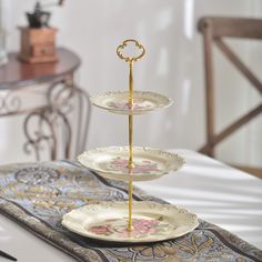 three tiered plate stand on top of a table