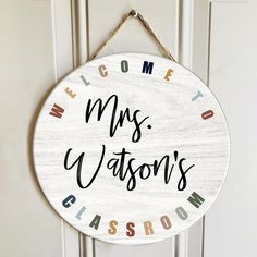 a welcome sign hanging on a door with the words welcome, mrs watson's classroom