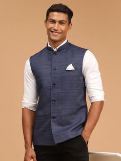 VASTRAMAY Navy Blue Cotton Blend Solid Nehru Jacket A stylish and versatile addition to your wardrobe, the VASTRAMAY Navy Blue Nehru Jacket is crafted from premium cotton blend fabric for comfort and durability. Key Features: Solid navy blue color Nehru collar design Cotton blend fabric Button closure Two side pockets Specifications: Color: Navy Blue Material: Cotton Blend Sizes Available: S, M, L, XL Material & Care: Machine wash cold, gentle cycle. Do not bleach. Tumble dry low. Warm iron if n Neru Jacket Men, Blue Nehru Jacket Men, Blue Stand Collar Blazer For Formal Occasions, Formal Blue Stand Collar Blazer, Formal Cotton Nehru Jacket With Long Sleeves, Blue Nehru Jacket With Stand Collar For Winter, Formal Long Sleeve Cotton Nehru Jacket, Blue Winter Nehru Jacket With Stand Collar, Blue Cotton Nehru Jacket With Long Sleeves