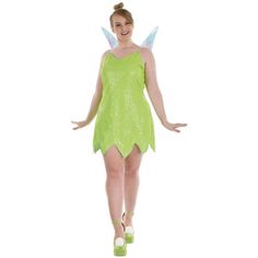 a woman in a green fairy costume is posing for the camera with her hands out