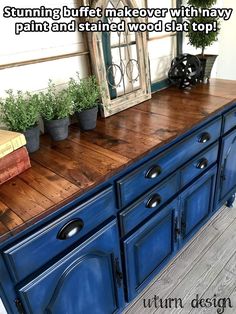 an old dresser is painted blue and has potted plants on top