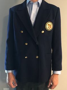 Vintage large navy double-breasted blue blazer in excellent condition. Cotton traditional, sophisticated garment.  Embroidered with ornate Cornell University badge - finely hand stitched with luxury gold bullion wire, silks and cottons. Golden engraved buttons.  Large: 41-43 inch chest Dry clean only Vintage Embroidered Blazer For Formal Occasions, Navy Formal Uniform Outerwear, Formal Blue Embroidered Outerwear, Uniform Style Double-breasted Formal Blazer, Ithaca Ny, Cornell University, Gold Bullion, Double Breasted Suit Jacket, Hand Stitched