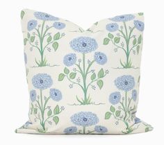 a pillow with blue flowers on it