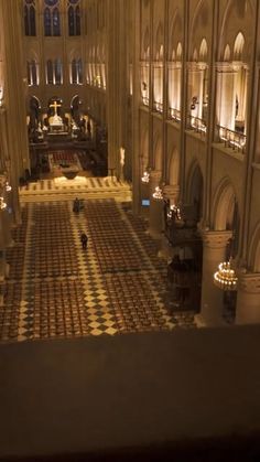 the interior of a large cathedral lit up at night