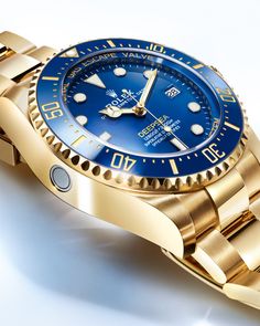 The new @Rolex Deepsea artfully combines 18ct yellow gold and shades of blue. The compression ring is made from blue ceramic, a technical innovation that marks a new way of integrating this material into the watch case. The helium escape valve, which works to protect the integrity of the watch during decompression, is manufactured in RLX titanium. #Rolex #RolexDeepsea #WatchesandWonders2024 #HamraJewelers Rolex Watches Women, Rolex Models, Rolex Oyster Perpetual, Clock Face